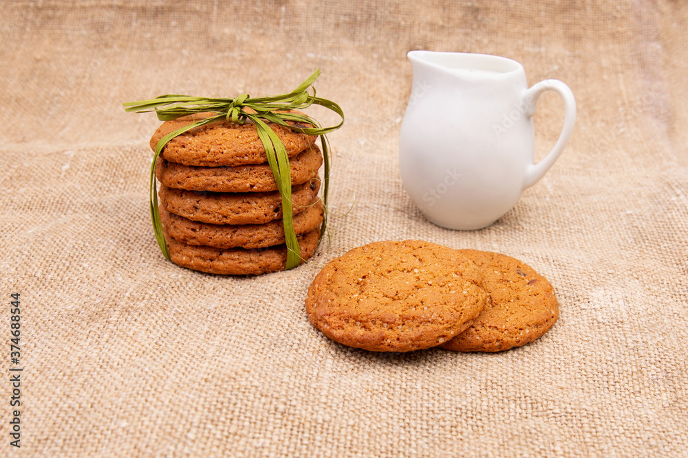 Wall mural Oatmeal cookies on old burlap