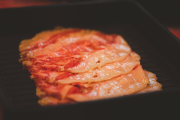 Beef slice on black tray for hot pot or grill (barbecue or yakiniku).