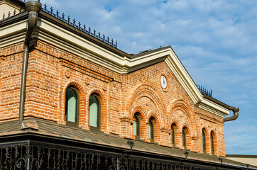 Fototapeta premium Old brick building with a clock .