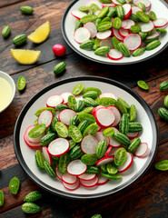 Cucamelon radish salad on rustic wooden table. healthy summer food