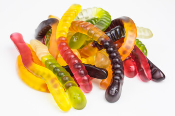 heap of chewy gummy candy worms