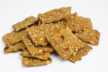 heap of spelt and lentil cracker with paprika and chili