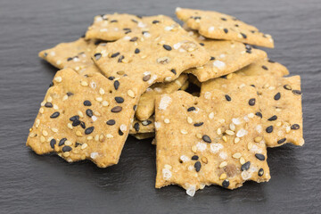 heap of spelt and lentil cracker with sesame and sea salt