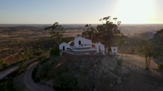 Ermida de Nossa Senhora de Aracelis aerial view, a hermitage and church perched on a Alentejo hill, looking out on beautiful views across the cultivated plateau. Portugal.