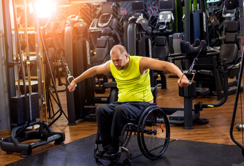 Disabled man training in the gym of rehabilitation center