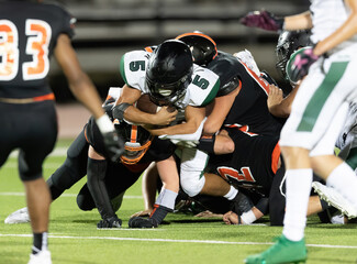 Great action photos of football players making amazing plays during a football game