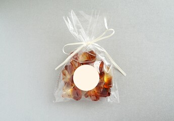 Party favor bag and empty round sticker mockup, blank sticker for design, silver background,...