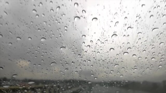 Slow Motion Of Rain Hitting On Glass Of A Moving Car On A Highway With A Wiper On FHD 1080P