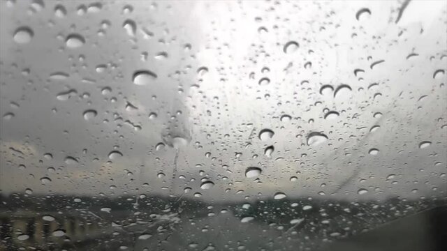 Slow Motion Of Rain Hitting On Glass Of A Moving Car On A Highway FHD 1080P