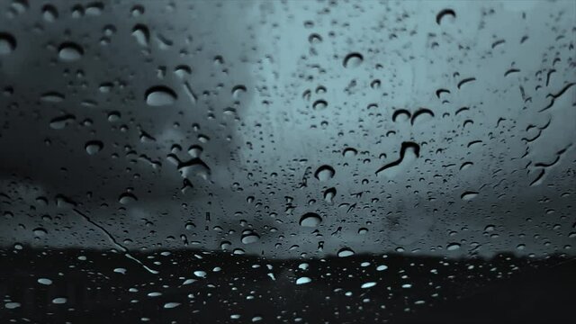 Slow Motion of Rain Water Droplets On The Car Glass With Cloudy Gloomy Background 1080 FHD