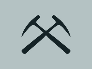 Crossed geological pick axes. Rock hammer