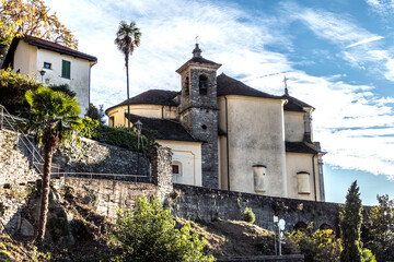 Fototapeta na wymiar beautiful church in Maccagno against a blue sky