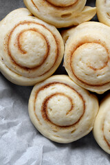 Raw cinnamon rolls of yeast dough ready to be baked