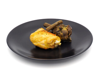 Cooked chicken thigh with roman artichoke isolated on white background
