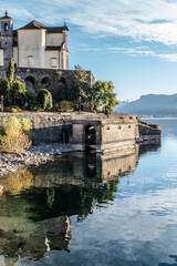 Beautiful church is reflecting in the port of Maccagno