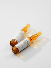 Close up view of the ampules with medicine on white back 
