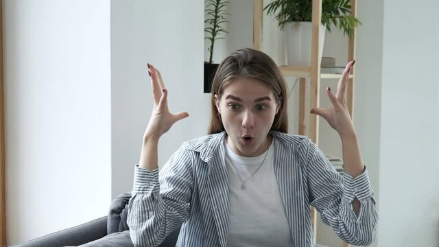 Mind blown reaction of millennial girl expressing her shock of something unbelievable. young caucasian woman express her feelings. excited pretty girl showing gesture of brain explosion in slow motion