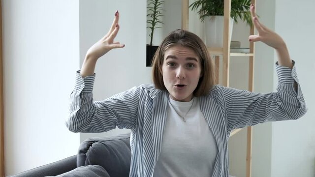 Mind blown reaction of millennial girl expressing her shock of something unbelievable. young caucasian woman express her feelings. excited pretty girl showing gesture of brain explosion in slow motion