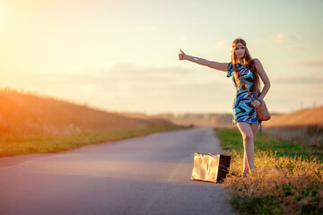 The girl hitchhiking