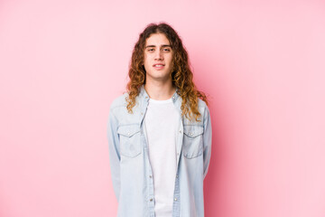 Long hair man posing isolated happy, smiling and cheerful.