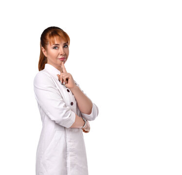 Confident Female Doctor In A White Coat Posing With A Slight Smile. Cropped Shot Isolated On White, Copy Space. Hospital, Doctor, Ambulance, Healthcare