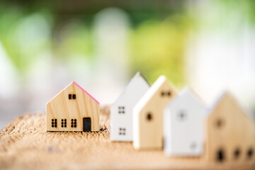 Many houses are lined up to present and choose to buying for owner home or investing for real estate on sunlight background, Fund concept.