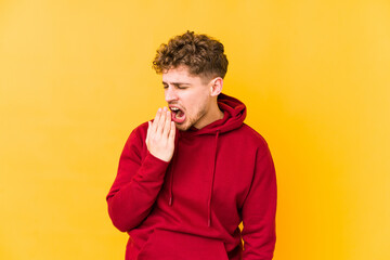  yawning showing a tired gesture covering mouth with hand.