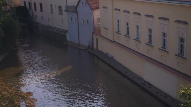 View of the island of Kampa and channel Certovka also called stream of the devil, and of one of its famous windmills. Prague, Czech Republic