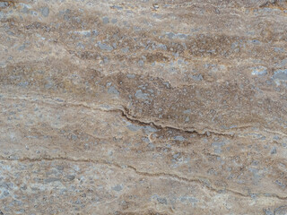 beige granite texture with spots and cracks close up