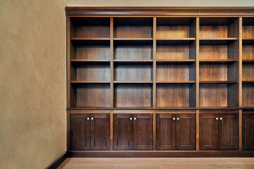 Wooden bookcase with empty shelves in home library © timltv