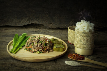 Spicy minced pork salad with sticky rice, Larb is traditional Thai food is the culture of the people in the northeast of Thailand