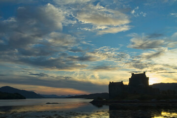 Fototapeta na wymiar A silhouette of Eileen Donan Castle at sunset near Dornie in the Western Highlands of Scotland