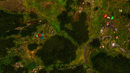 Camping in the mountains, from a height you can see a tent camp near the alpine lake Brebeneskul, a place to spend the night and rest.
