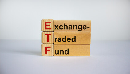 Concept words 'ETF,  Exchange-Traded Fund' on cubes on a beautiful white background. Business concept. Copy space.