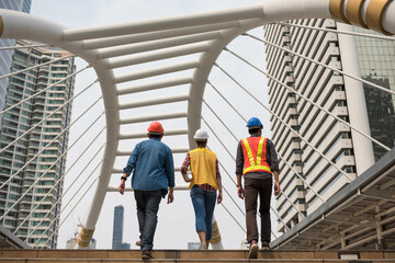 Engineer team walk in city and discuss project
