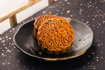 Mid-Autumn Festival concept, Traditional mooncakes on table  with teacup