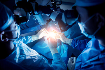 A team of surgeons performing brain surgery to remove a tumor.
