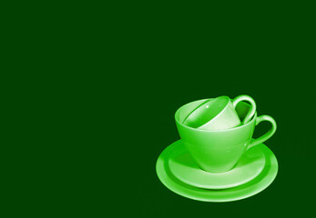 Pop art style green color tone stack of two different size of coffee cup sets
