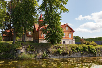 Naklejka na ściany i meble Wooden Houses in front of the Kuressaare Castle on the island Saaremaa, Estonia