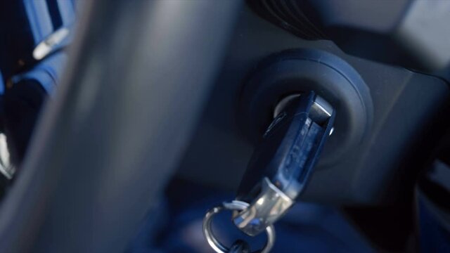 Added shaking from moving the car! The driver inserts the ignition key into the ignition lock, turns it and starts the engine, then turns off the engine and removes the key. Closeup