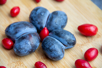 plum fruit in the form of hearts and dogwood berries