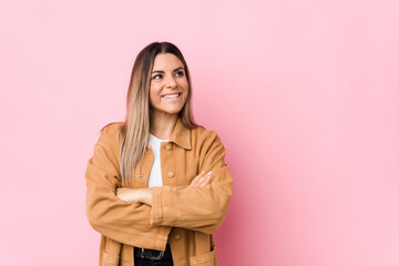 Young caucasian woman isolated smiling confident with crossed arms.