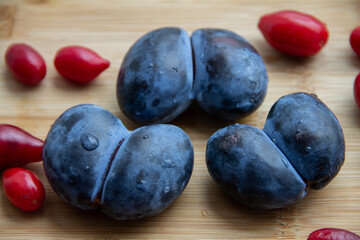 plum fruit in the form of hearts and dogwood berries