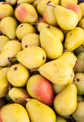Detail of some delicious bulk pears in a street market.
