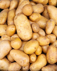 Detail of some potatoes in a street market.