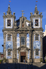 Fototapeta na wymiar Azulejos panels on the towers of Church of Saint Ildefonso in Porto, Portugal