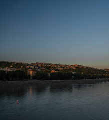 Obraz premium Bratislava capital in summer evening with color sunset and river Donau