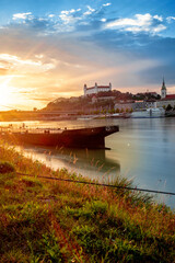 view of Bratislava castle on late afternoon with beautiful sunset on river Danube, Slovakia