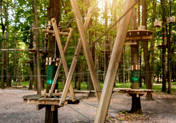 Fototapeta na wymiar Rope park in a forest. Adventure summer park.