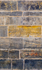 Wall seamless pattern made from massive old stone blocks. The facade of an old building made of large antique stones